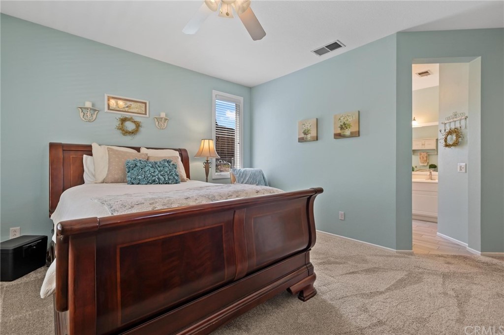 20803 Millbrook Street Riverside, CA 92508 - Photo 20 of 44 a living room with stainless steel appliances kitchen island a table chairs and window