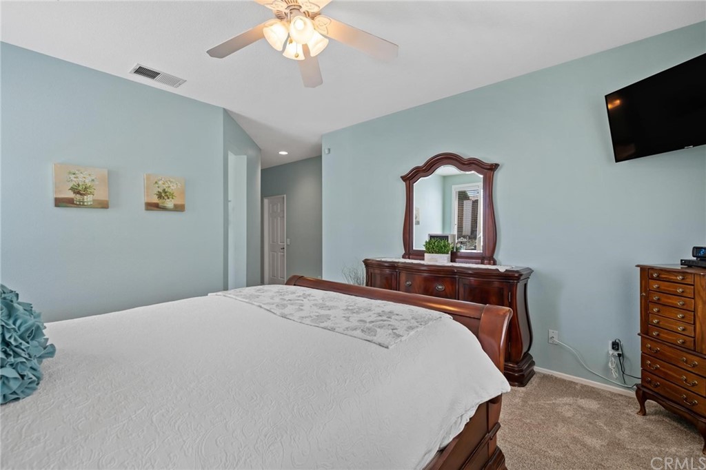 20803 Millbrook Street Riverside, CA 92508 - Photo 21 of 44 a bedroom with a bed and a flat screen tv