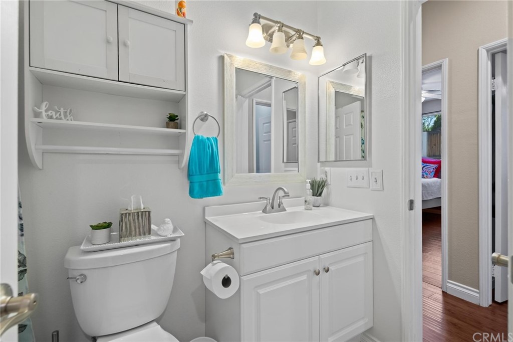 20803 Millbrook Street Riverside, CA 92508 - Photo 32 of 44 a bathroom with a sink toilet and mirror