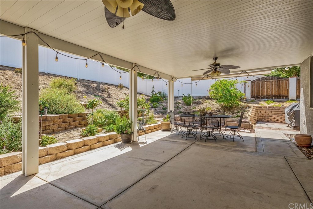 20803 Millbrook Street Riverside, CA 92508 - Photo 33 of 44 a view of a porch with chairs and backyard of the house