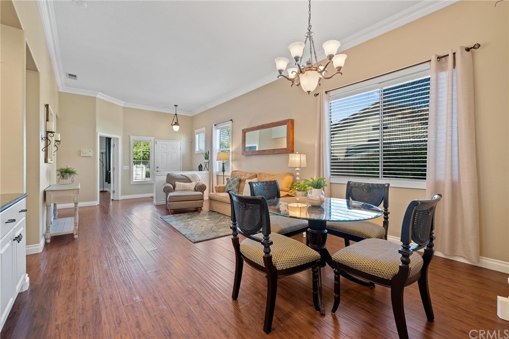 20803 Millbrook Street Riverside, CA 92508 - Photo 5 of 44 a view of a dining room with furniture wooden floor and chandelier