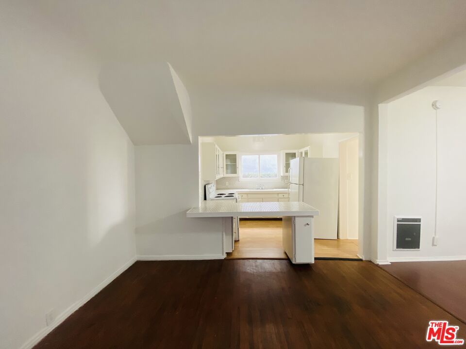 44 Rose Avenue Venice, CA 90291 - Photo 28 of 33 a living room with stainless steel appliances wooden floor and view kitchen