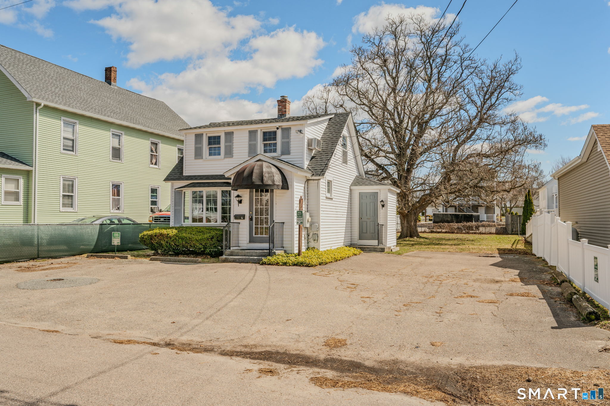 6 Hatch Street Stonington, CT 06355 - Photo 2 of 26 a front view of a house with a yard