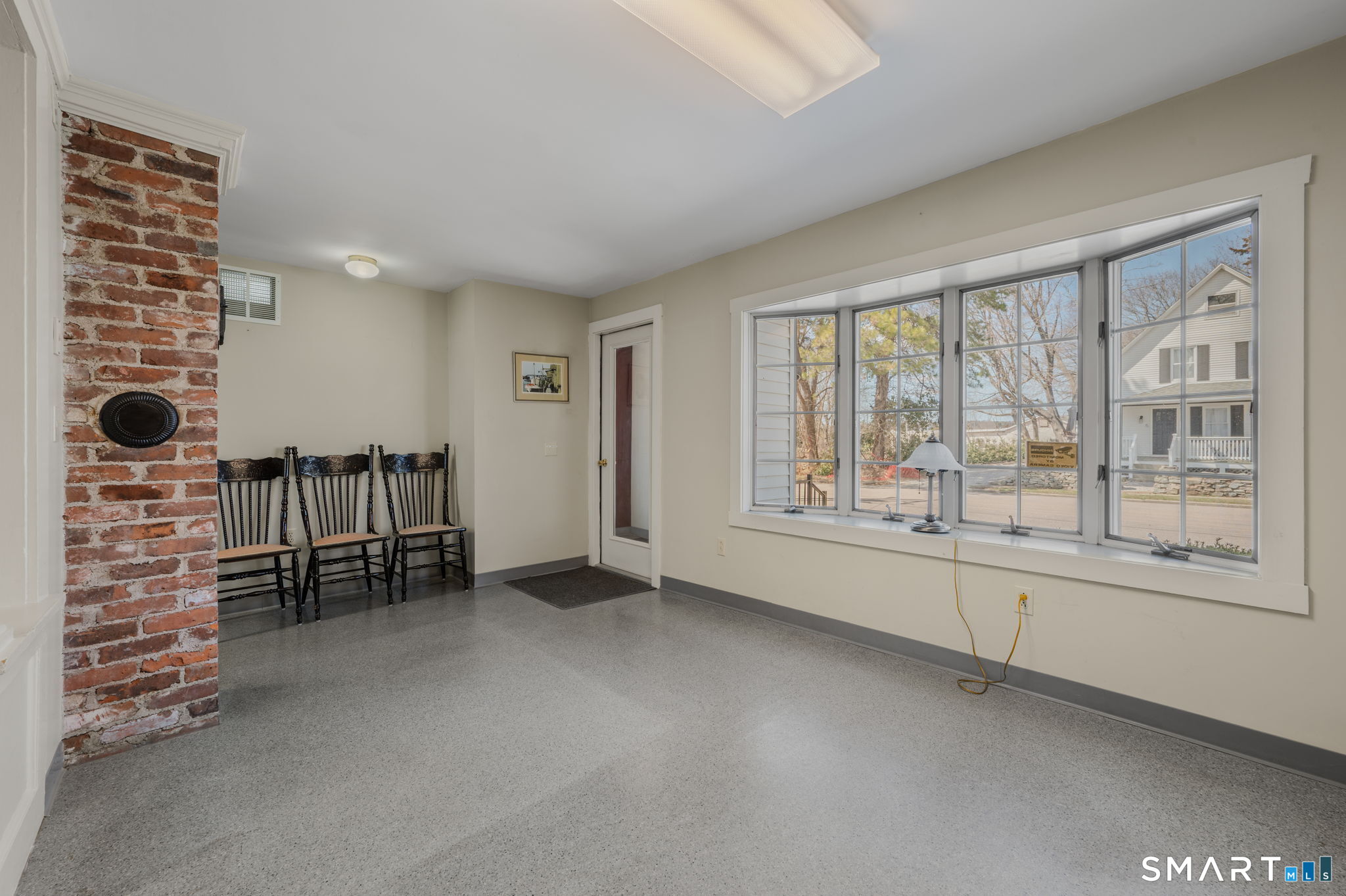 6 Hatch Street Stonington, CT 06355 - Photo 7 of 26 an empty room with windows and balcony