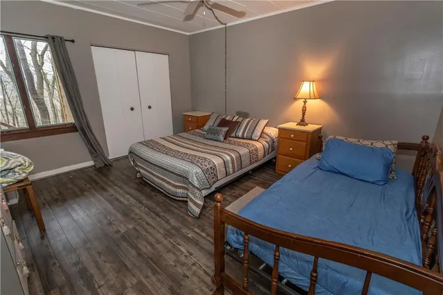 a bedroom with double bed and a window