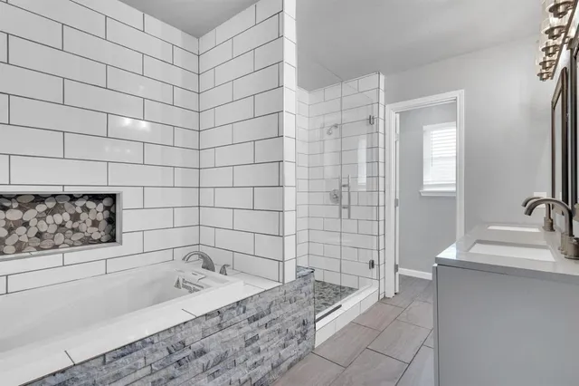 a bathroom with a bathtub and sink