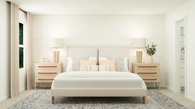 a bedroom with a bed and a cabinets