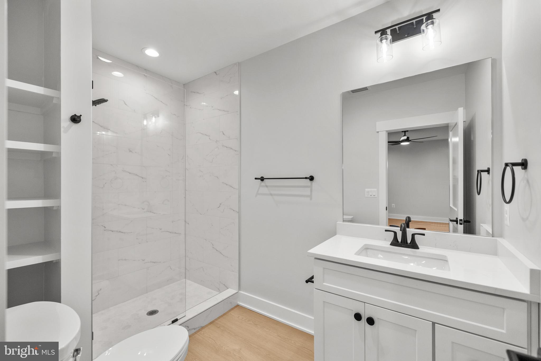 1852 Griffith Road Falls Church, VA 22043 - Photo 104 of 110 a bathroom with a sink shower and a mirror
