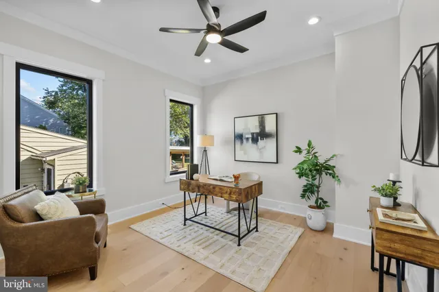 a living room with fireplace furniture and a flat screen tv