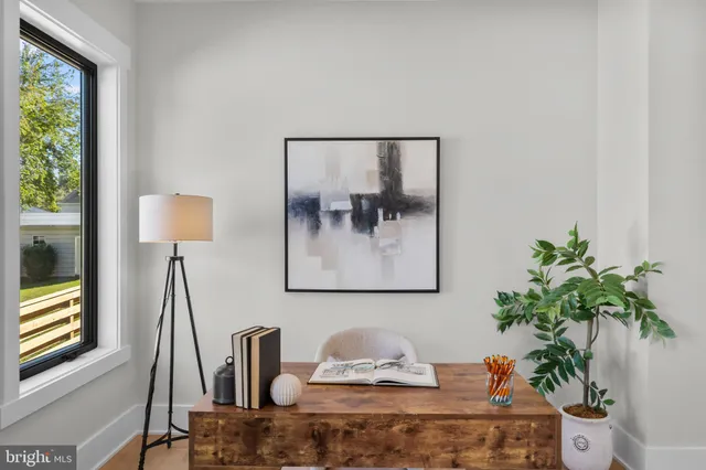 a large white kitchen with stainless steel appliances kitchen island granite countertop a large stove a sink dishwasher and a refrigerator with wooden floor