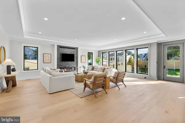 a kitchen with kitchen island granite countertop a sink cabinets and stainless steel appliances