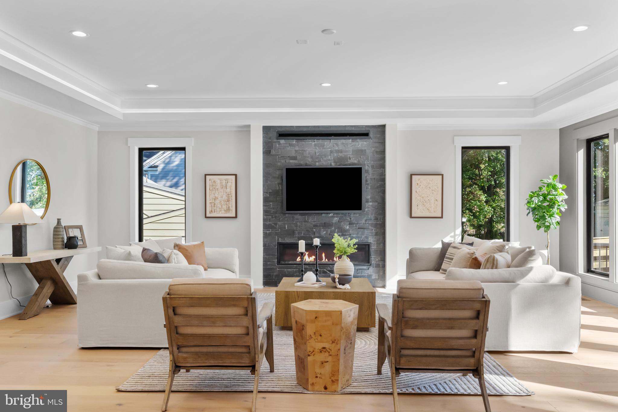 1852 Griffith Road Falls Church, VA 22043 - Photo 20 of 110 a living room with fireplace furniture and a flat screen tv