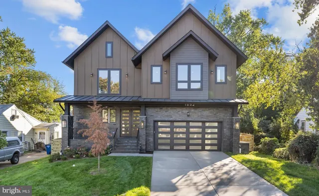 a living room with table or chairs and a dining table with wooden floor