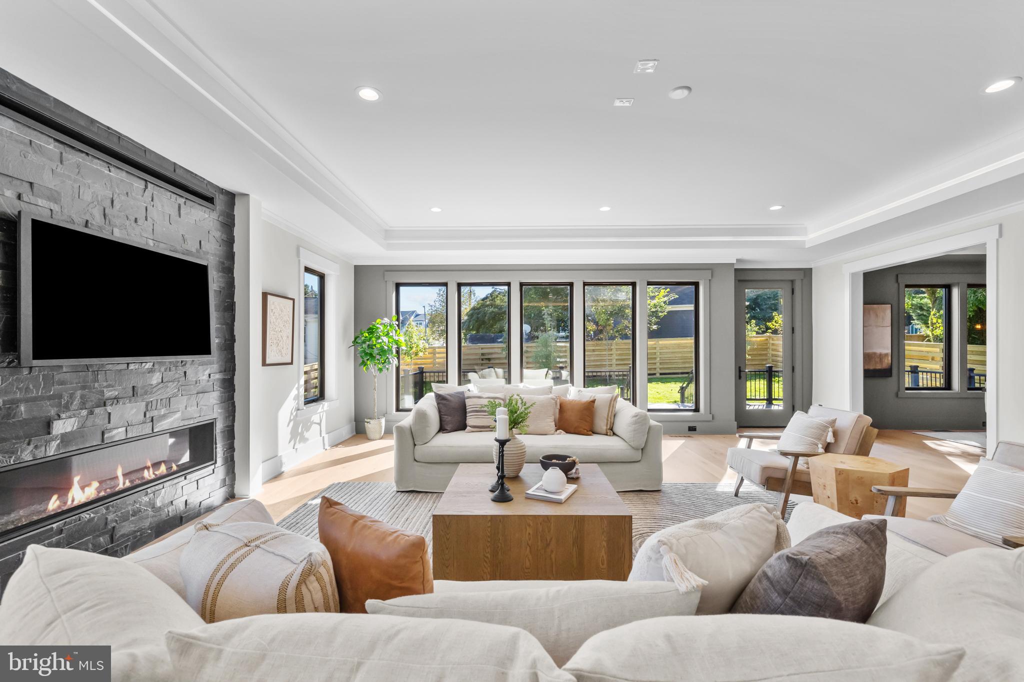 1852 Griffith Road Falls Church, VA 22043 - Photo 25 of 110 a living room with fireplace furniture and a flat screen tv