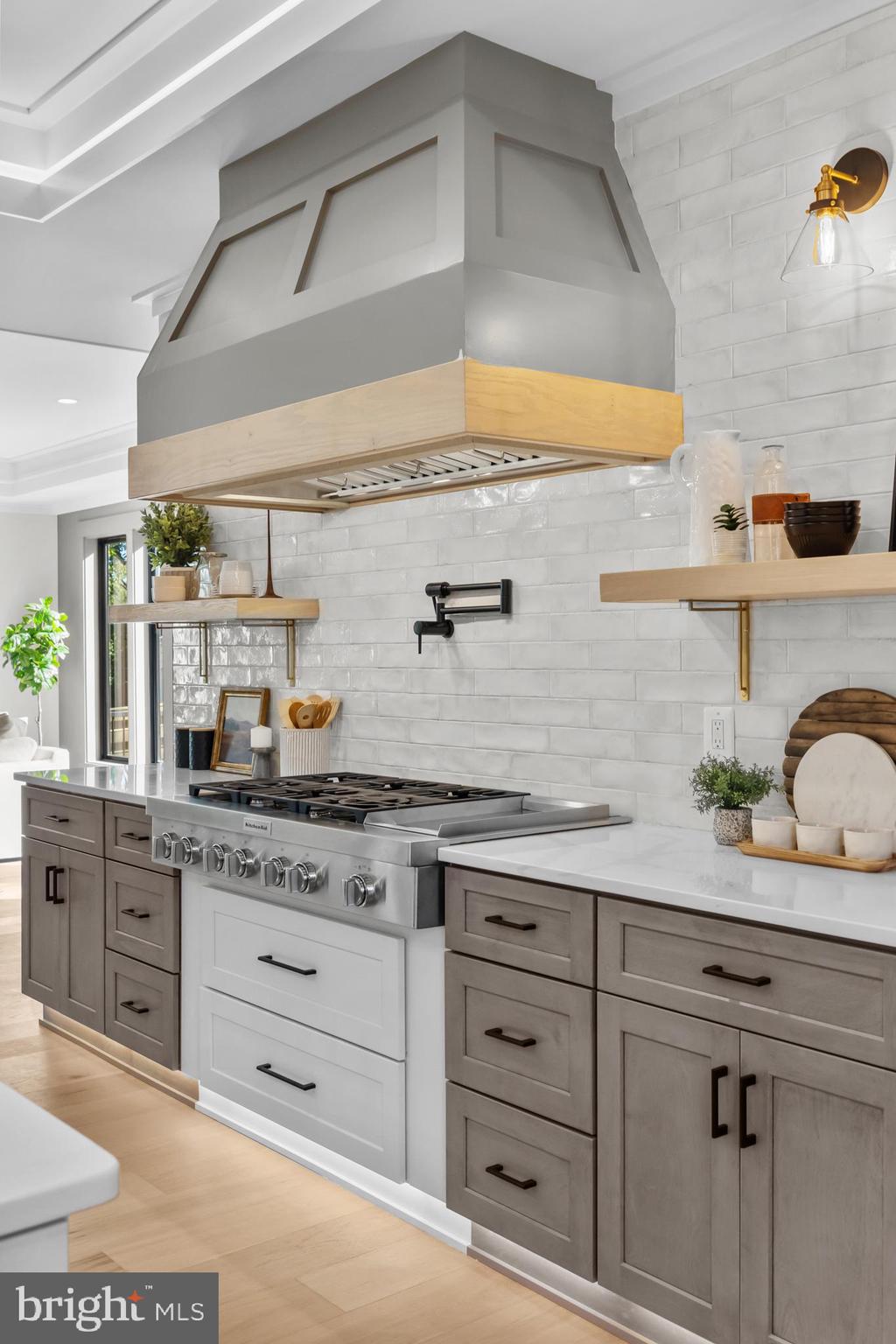 1852 Griffith Road Falls Church, VA 22043 - Photo 30 of 110 a kitchen with granite countertop white cabinets and white stainless steel appliances