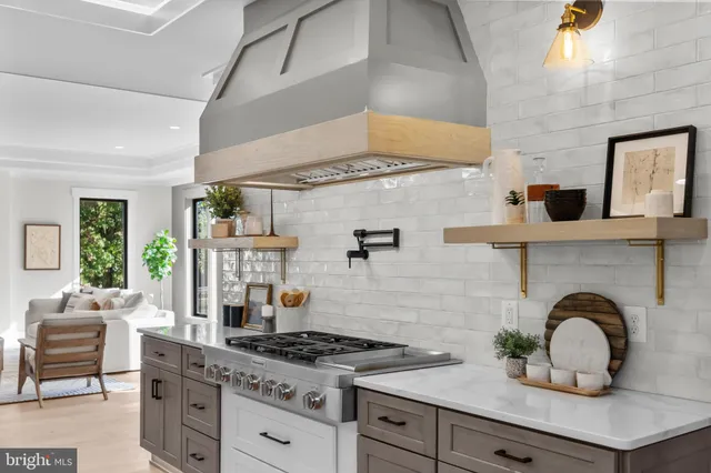 a spacious bathroom with a tub shower and window