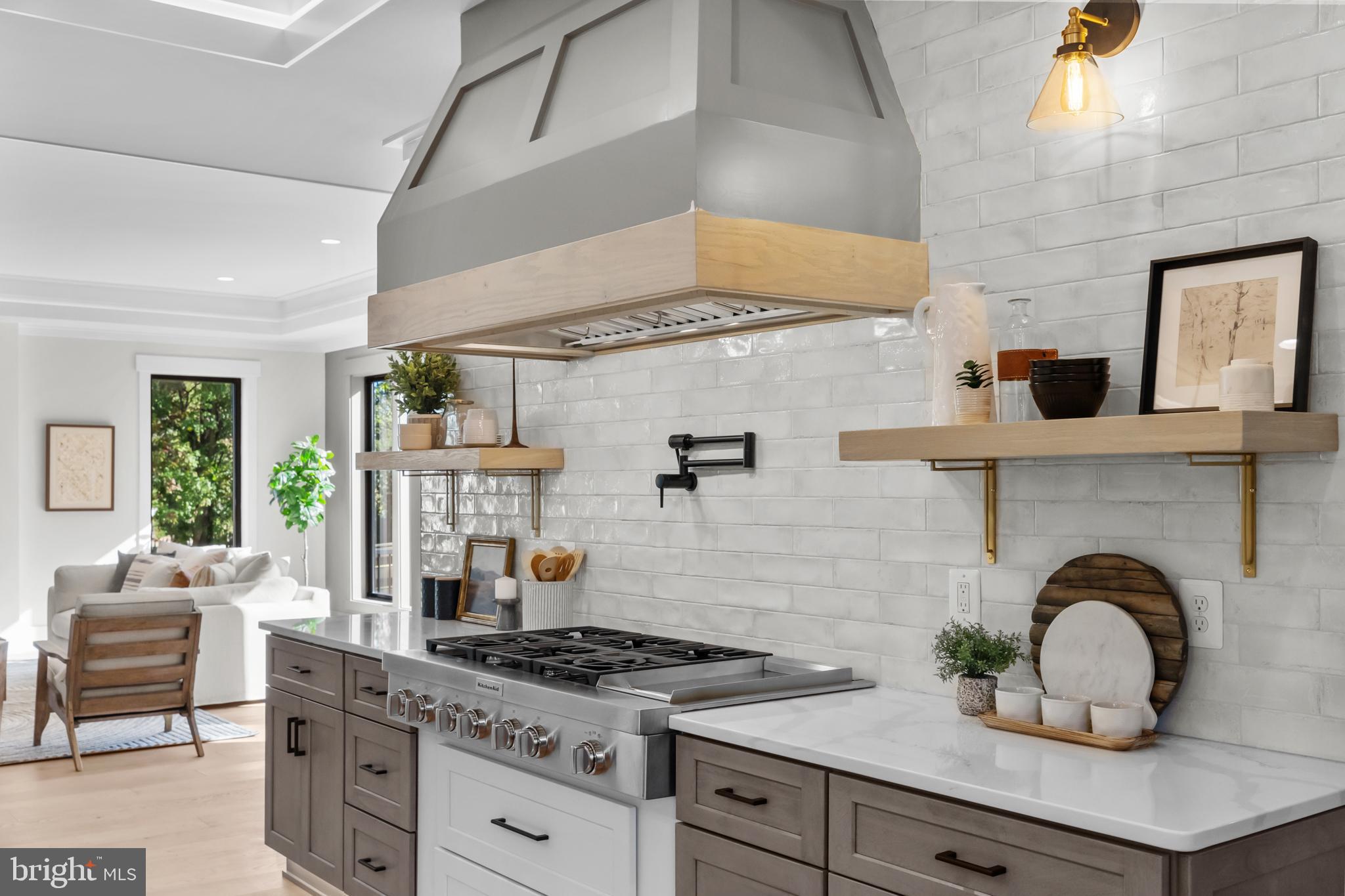 1852 Griffith Road Falls Church, VA 22043 - Photo 31 of 110 a kitchen with a stove a sink and chairs