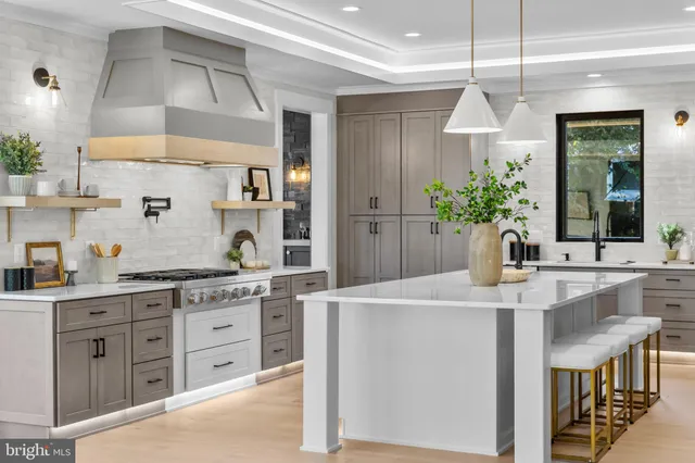 a view of a hallway with entryway stairs and hall with wooden floor