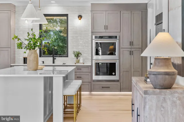 a kitchen with a table and chairs