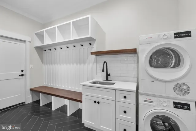 a bathroom with a sink a toilet and a bathtub