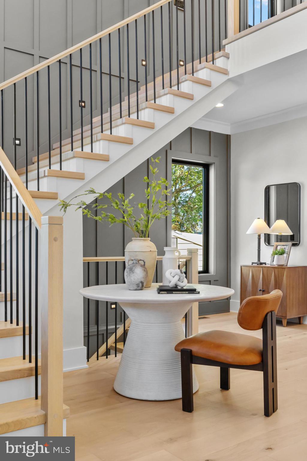 1852 Griffith Road Falls Church, VA 22043 - Photo 5 of 110 a living room with table or chairs and a dining table with wooden floor