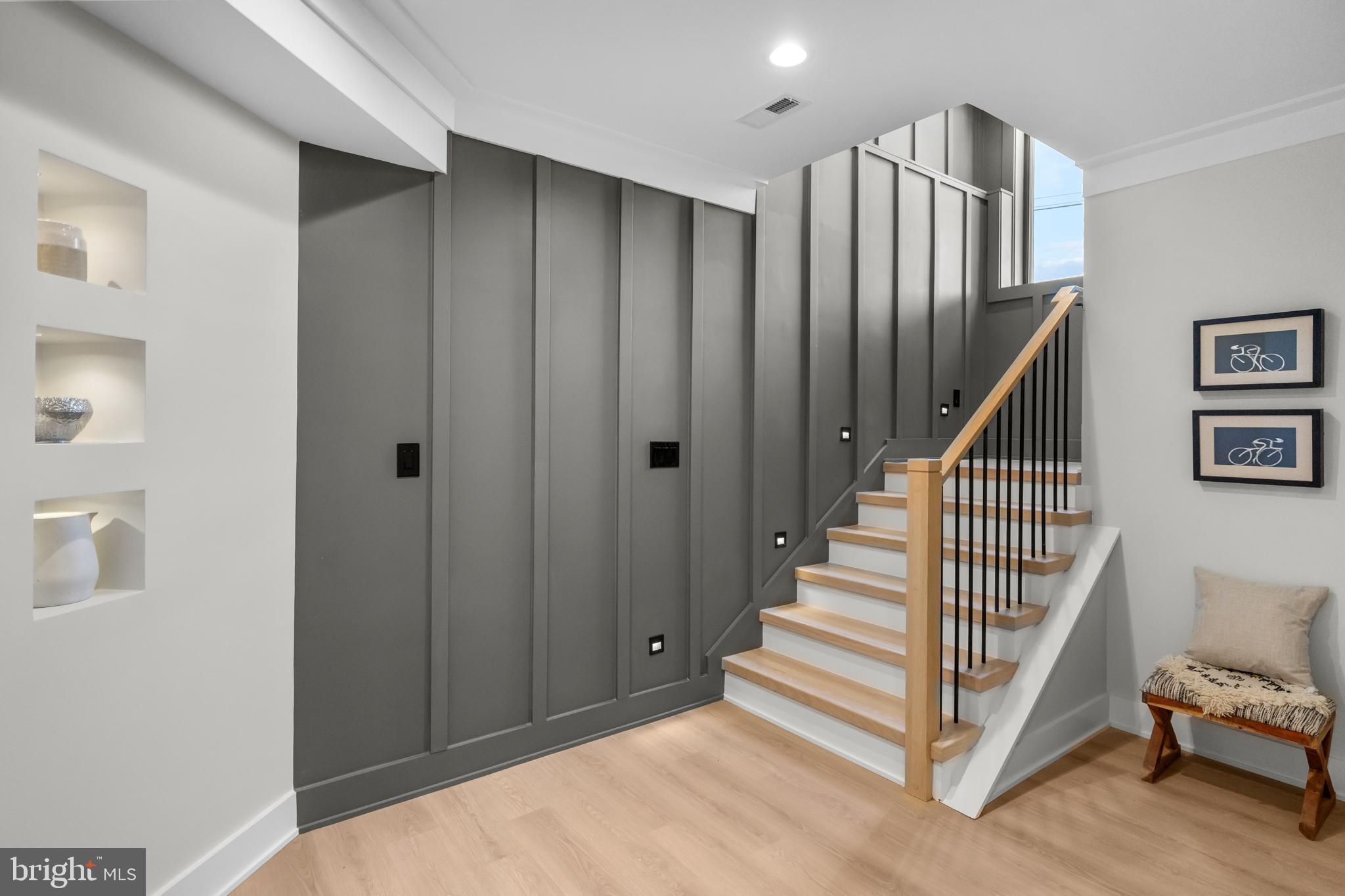 1852 Griffith Road Falls Church, VA 22043 - Photo 87 of 110 a view of a hallway with entryway stairs and hall with wooden floor
