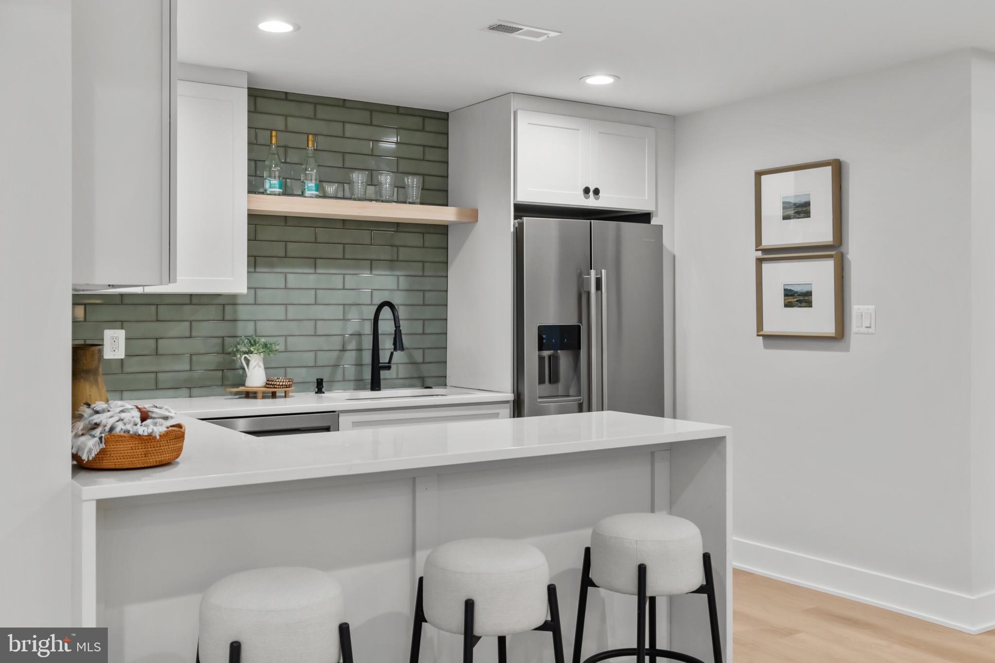 1852 Griffith Road Falls Church, VA 22043 - Photo 91 of 110 a kitchen with stainless steel appliances granite countertop a sink refrigerator and cabinets