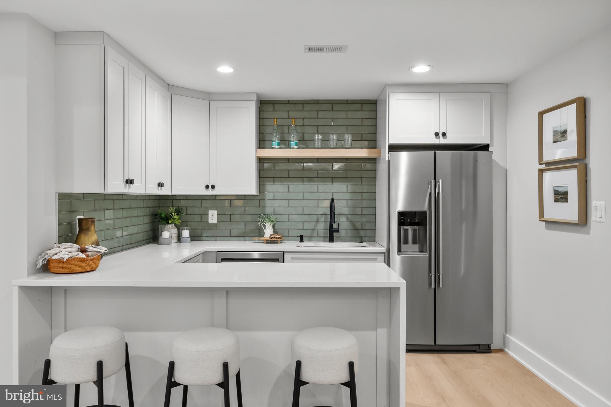 1852 Griffith Road Falls Church, VA 22043 - Photo 92 of 110 a kitchen with stainless steel appliances granite countertop a refrigerator and a stove