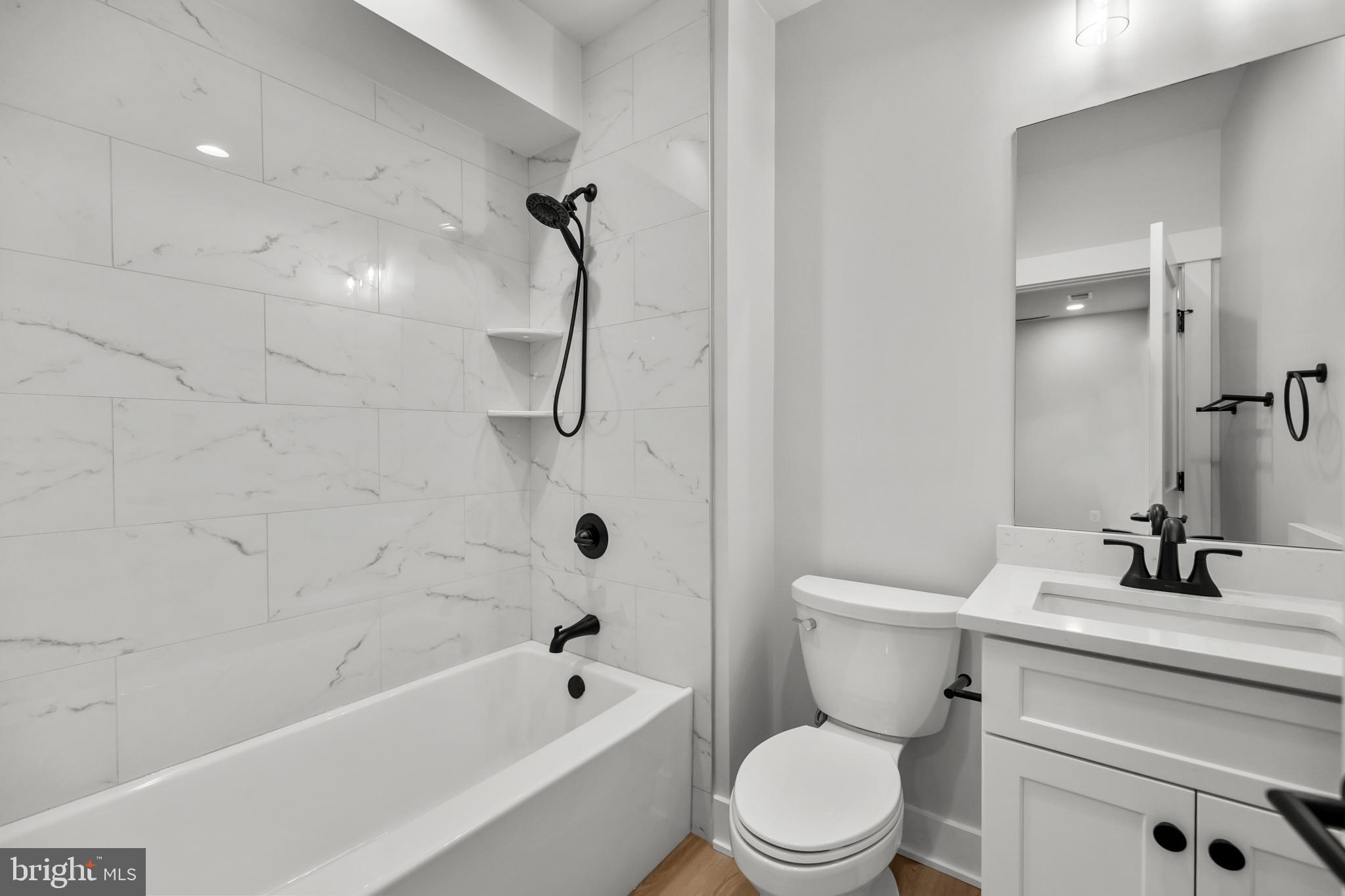 1852 Griffith Road Falls Church, VA 22043 - Photo 100 of 110 a bathroom with a sink a toilet and a bathtub