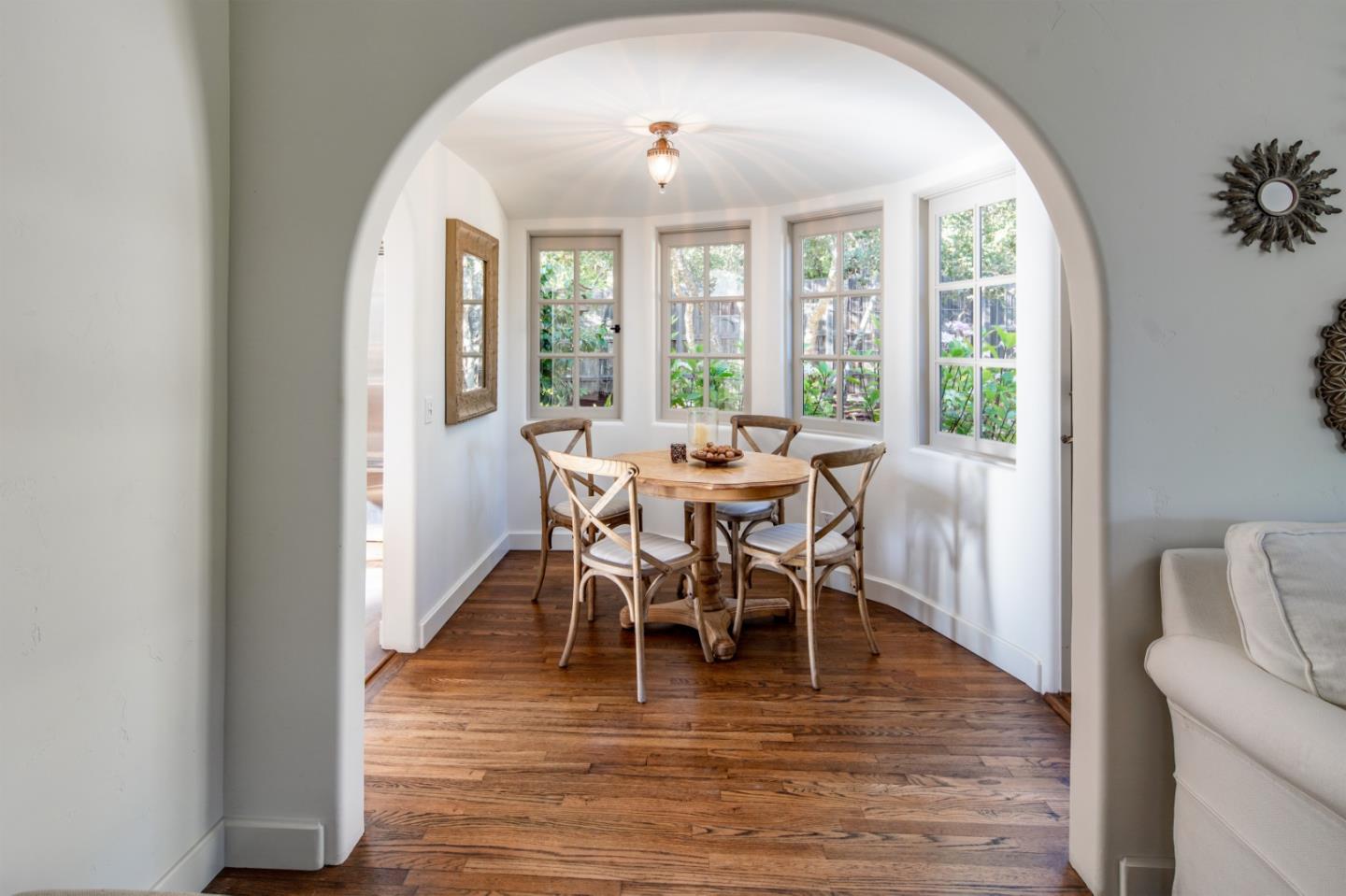 25148 Hatton Road Carmel, CA 93923 - Photo 11 of 33 a view of a dining room with furniture window and wooden floor