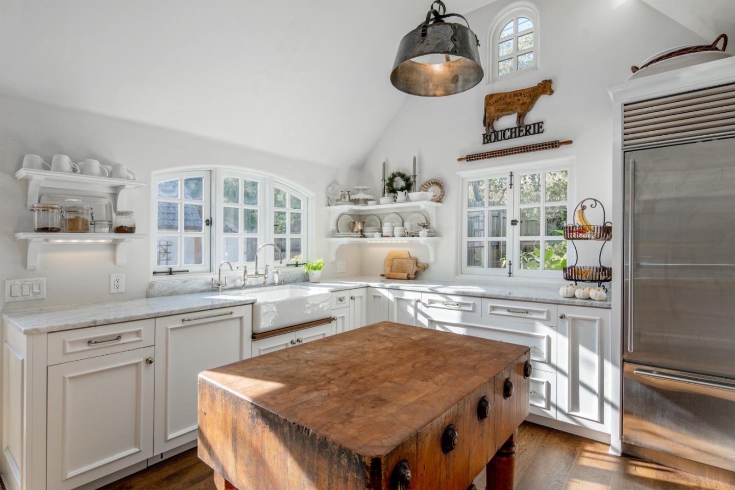 25148 Hatton Road Carmel, CA 93923 - Photo 13 of 33 a kitchen with stainless steel appliances granite countertop a stove and cabinets