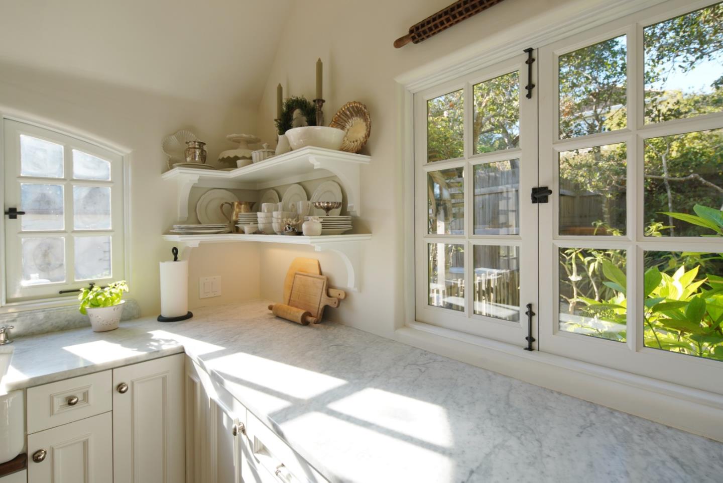 25148 Hatton Road Carmel, CA 93923 - Photo 16 of 33 a bedroom with a bed and large windows