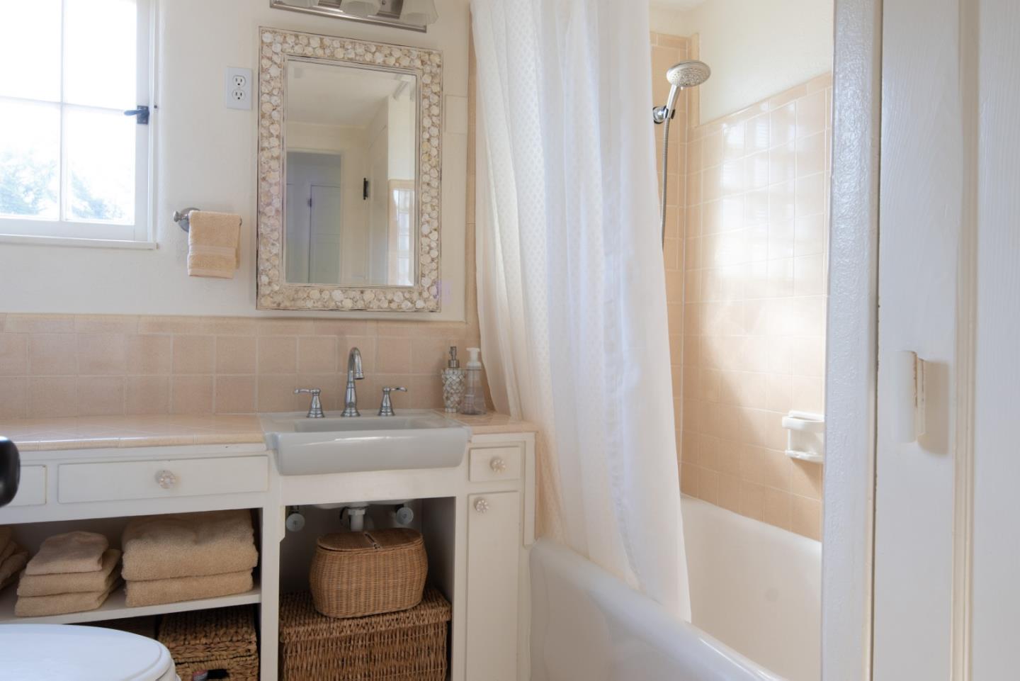 25148 Hatton Road Carmel, CA 93923 - Photo 20 of 33 a bathroom with a sink and a mirror