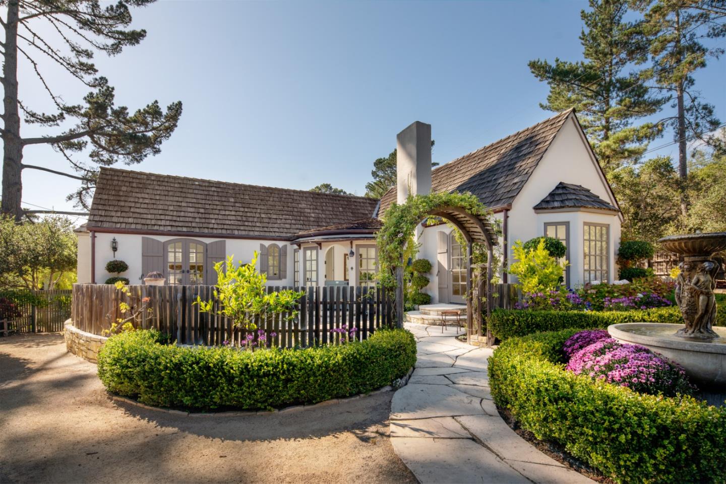 25148 Hatton Road Carmel, CA 93923 - Photo 2 of 33 a front view of house with yard and green space