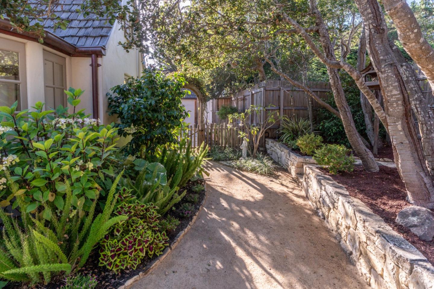 25148 Hatton Road Carmel, CA 93923 - Photo 24 of 33 a backyard of a house with lots of green space