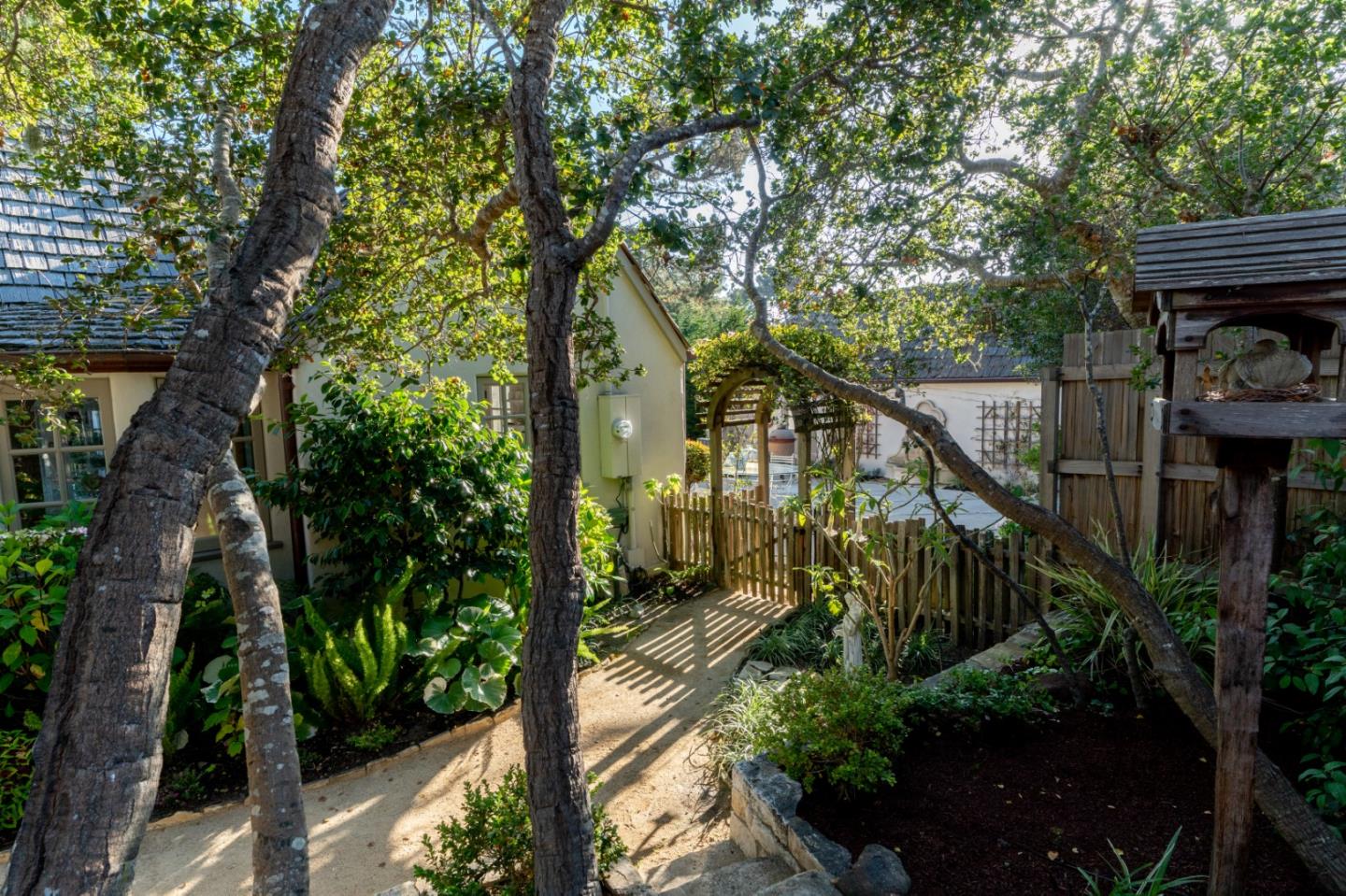 25148 Hatton Road Carmel, CA 93923 - Photo 27 of 33 a balcony with wooden fence and potted plants
