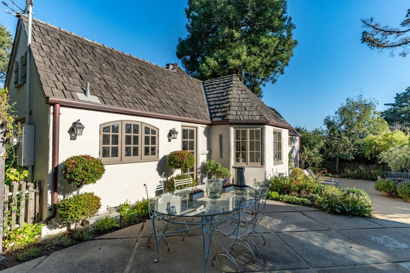 25148 Hatton Road Carmel, CA 93923 - Photo 29 of 33 a view of a house with backyard sitting area and garden