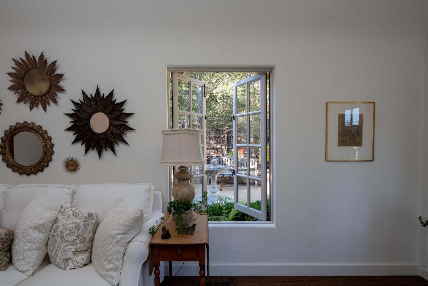 25148 Hatton Road Carmel, CA 93923 - Photo 9 of 33 a living room with furniture and a potted plant