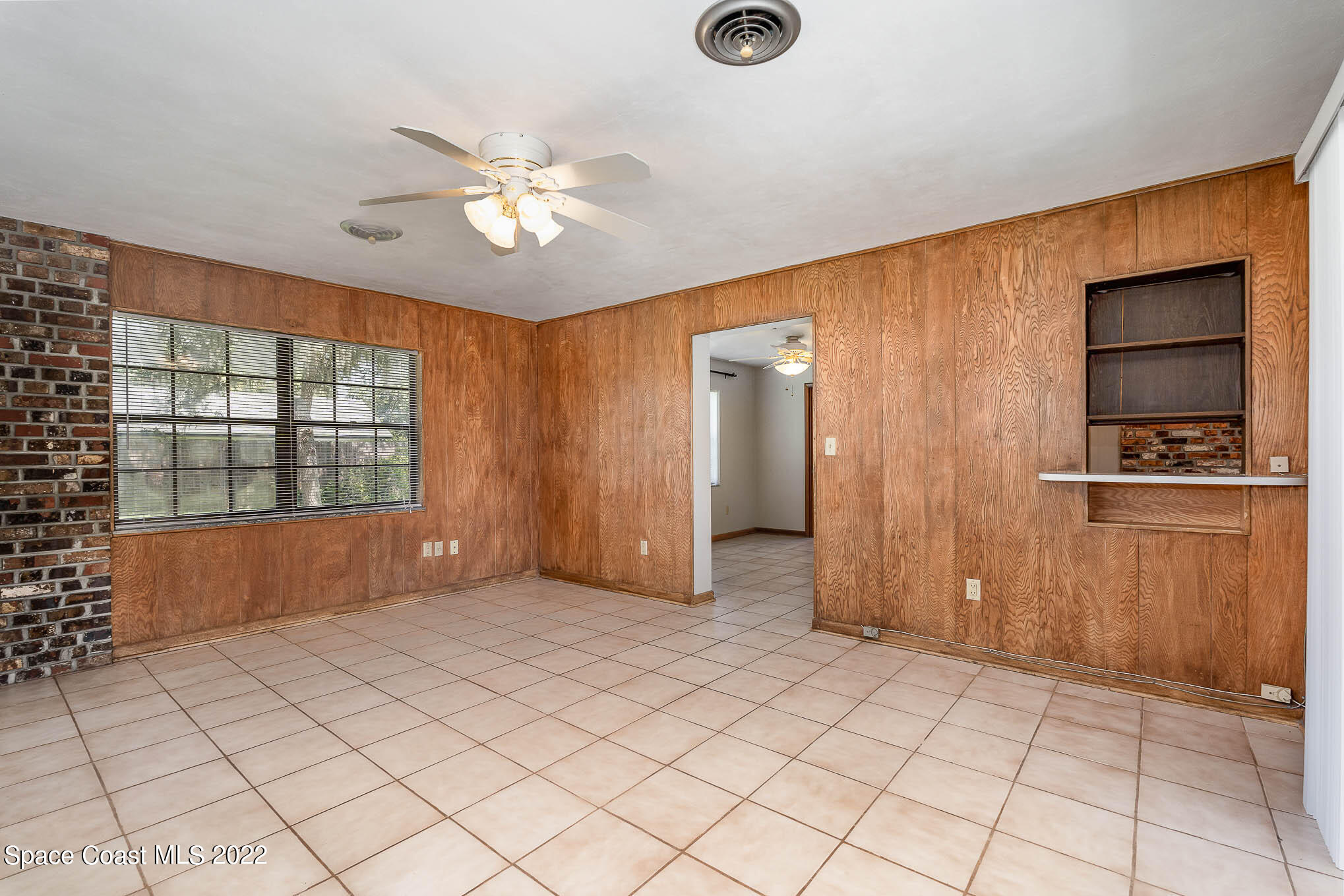 2676 Lemon Street Northeast Palm Bay, FL 32905 - Photo 11 of 35 a view of an empty room with window and cabinet