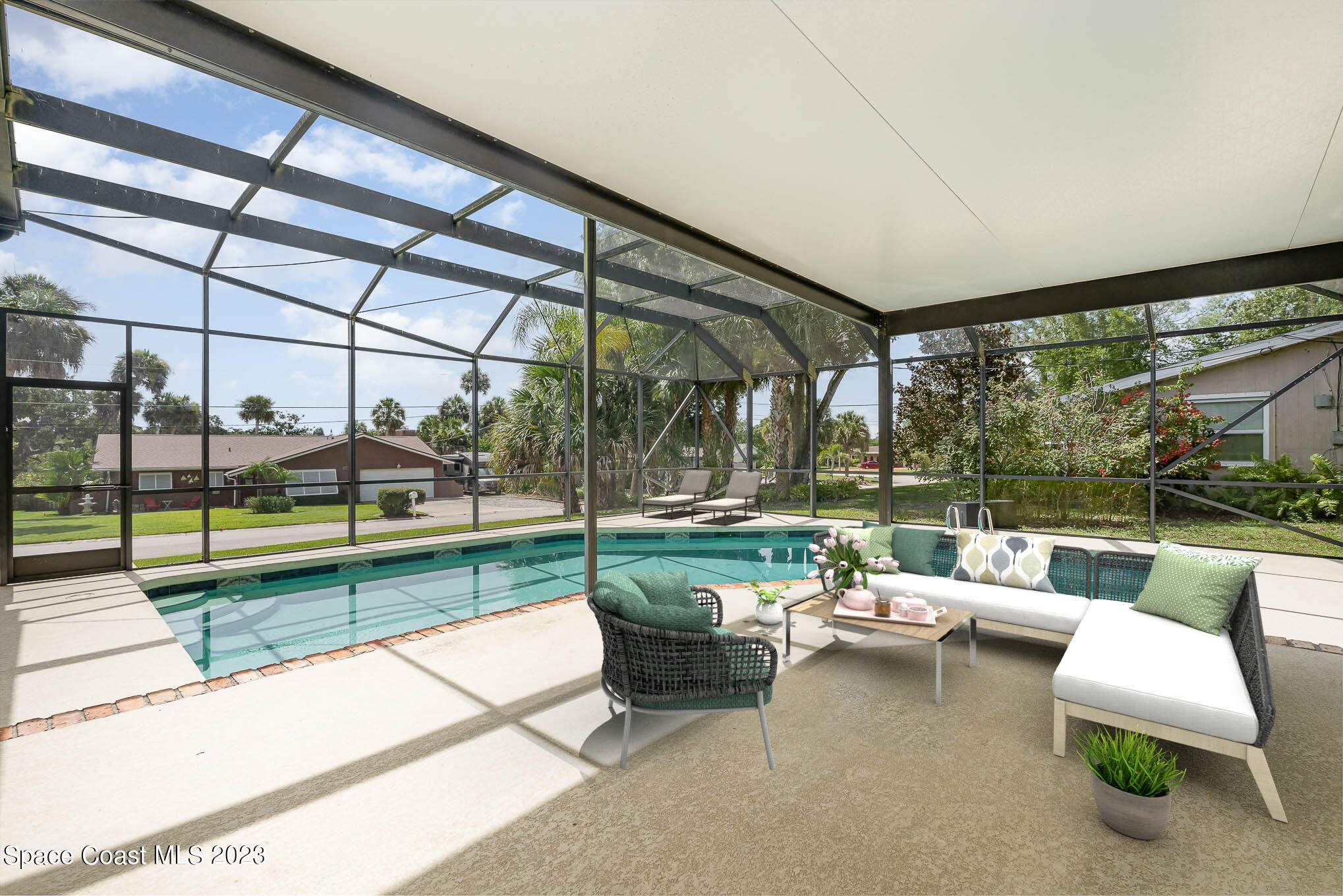 2676 Lemon Street Northeast Palm Bay, FL 32905 - Photo 16 of 35 a balcony with couple of chairs and a couch