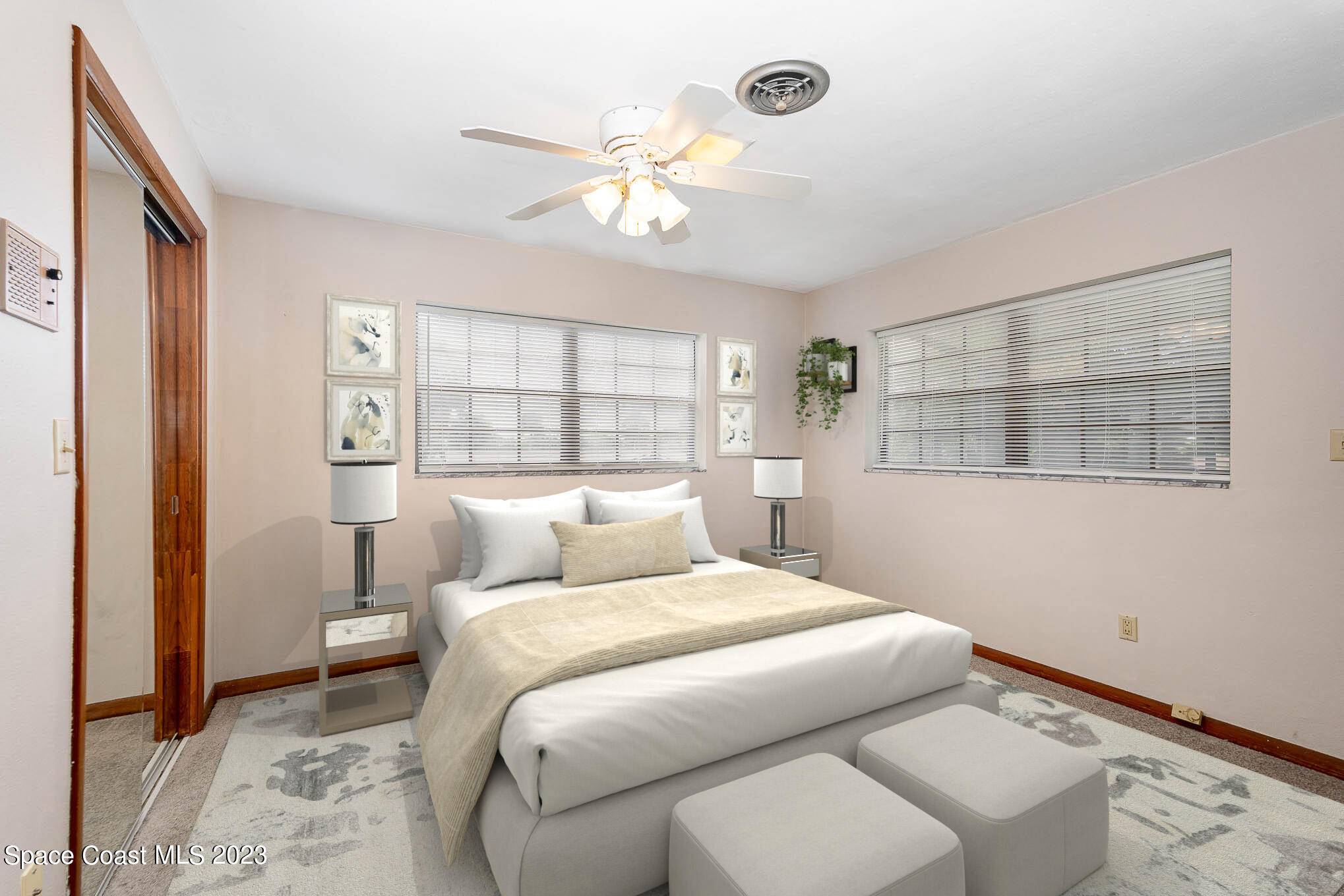 2676 Lemon Street Northeast Palm Bay, FL 32905 - Photo 19 of 35 a bedroom with a large bed and a window