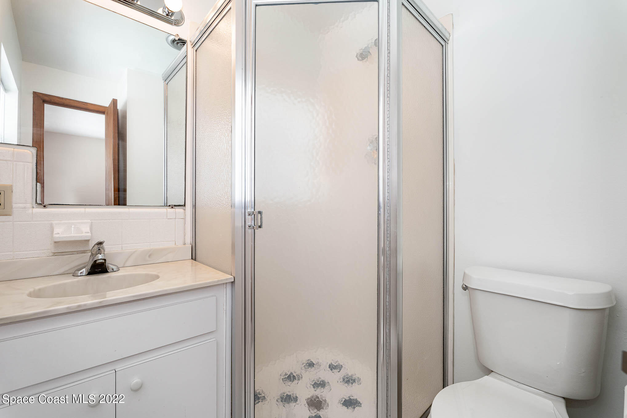 2676 Lemon Street Northeast Palm Bay, FL 32905 - Photo 20 of 35 a bathroom with a sink toilet and shower