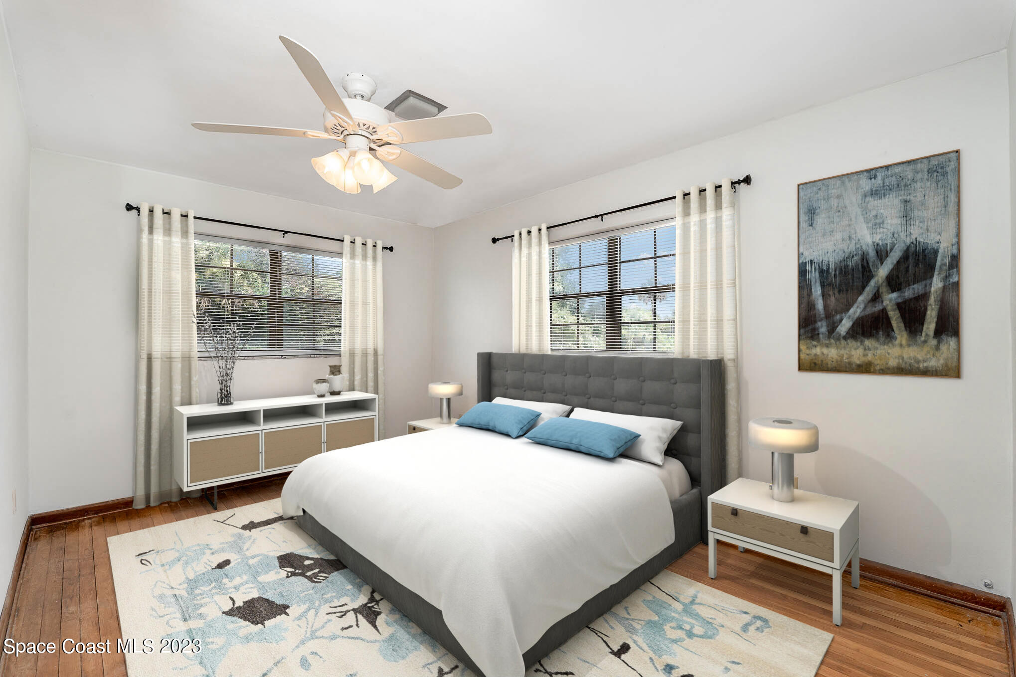 2676 Lemon Street Northeast Palm Bay, FL 32905 - Photo 22 of 35 a bedroom with a large bed and a window