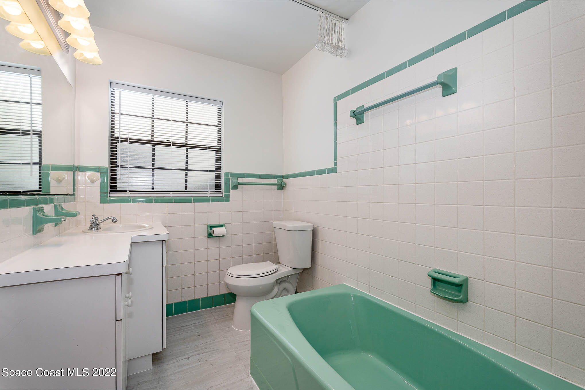 2676 Lemon Street Northeast Palm Bay, FL 32905 - Photo 25 of 35 a bathroom with a sink a toilet and tub