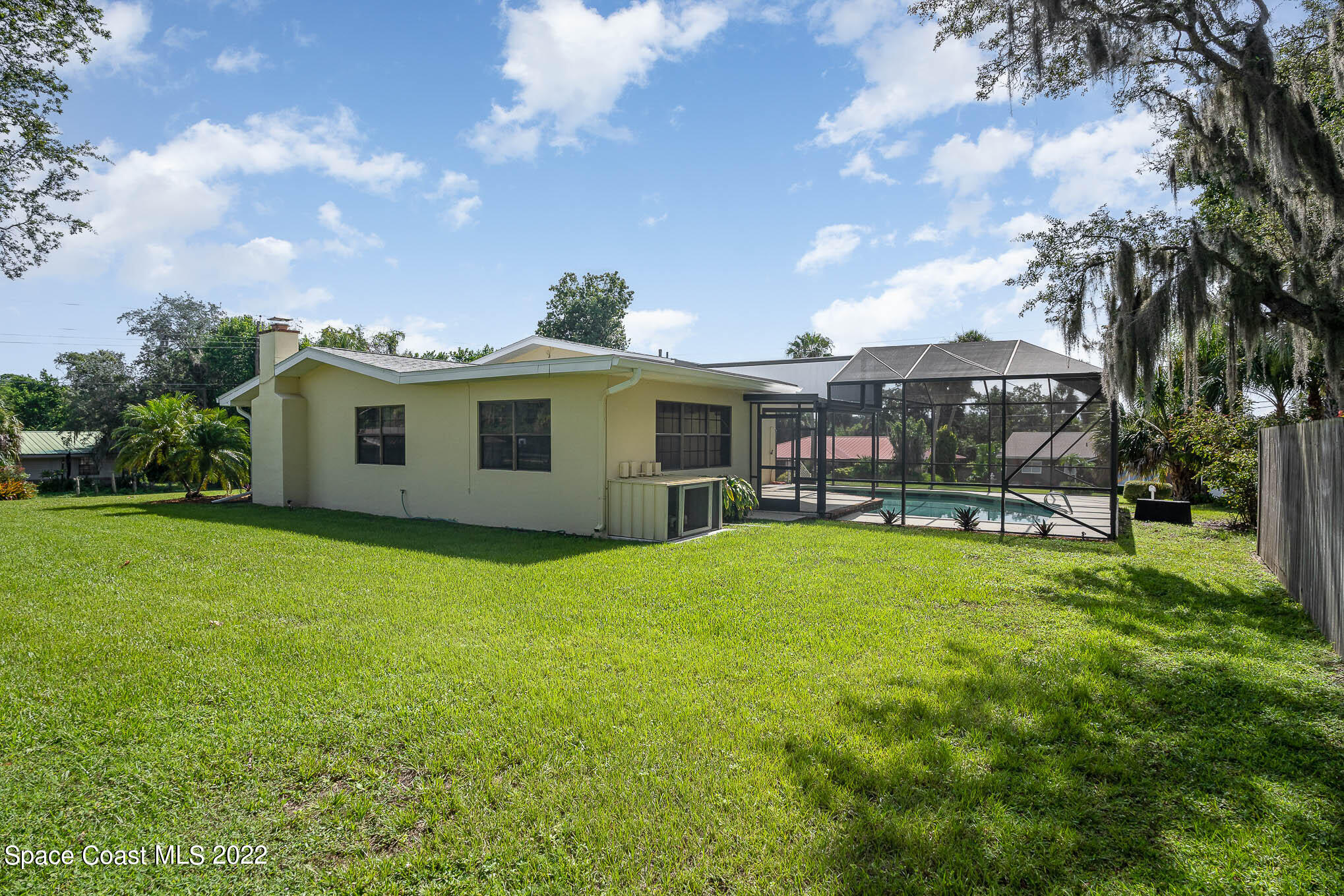 2676 Lemon Street Northeast Palm Bay, FL 32905 - Photo 32 of 35 a view of a house with backyard porch and garden