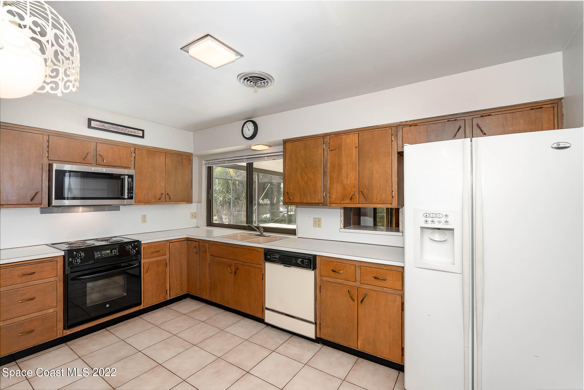 2676 Lemon Street Northeast Palm Bay, FL 32905 - Photo 6 of 35 a kitchen with granite countertop stainless steel appliances and sink