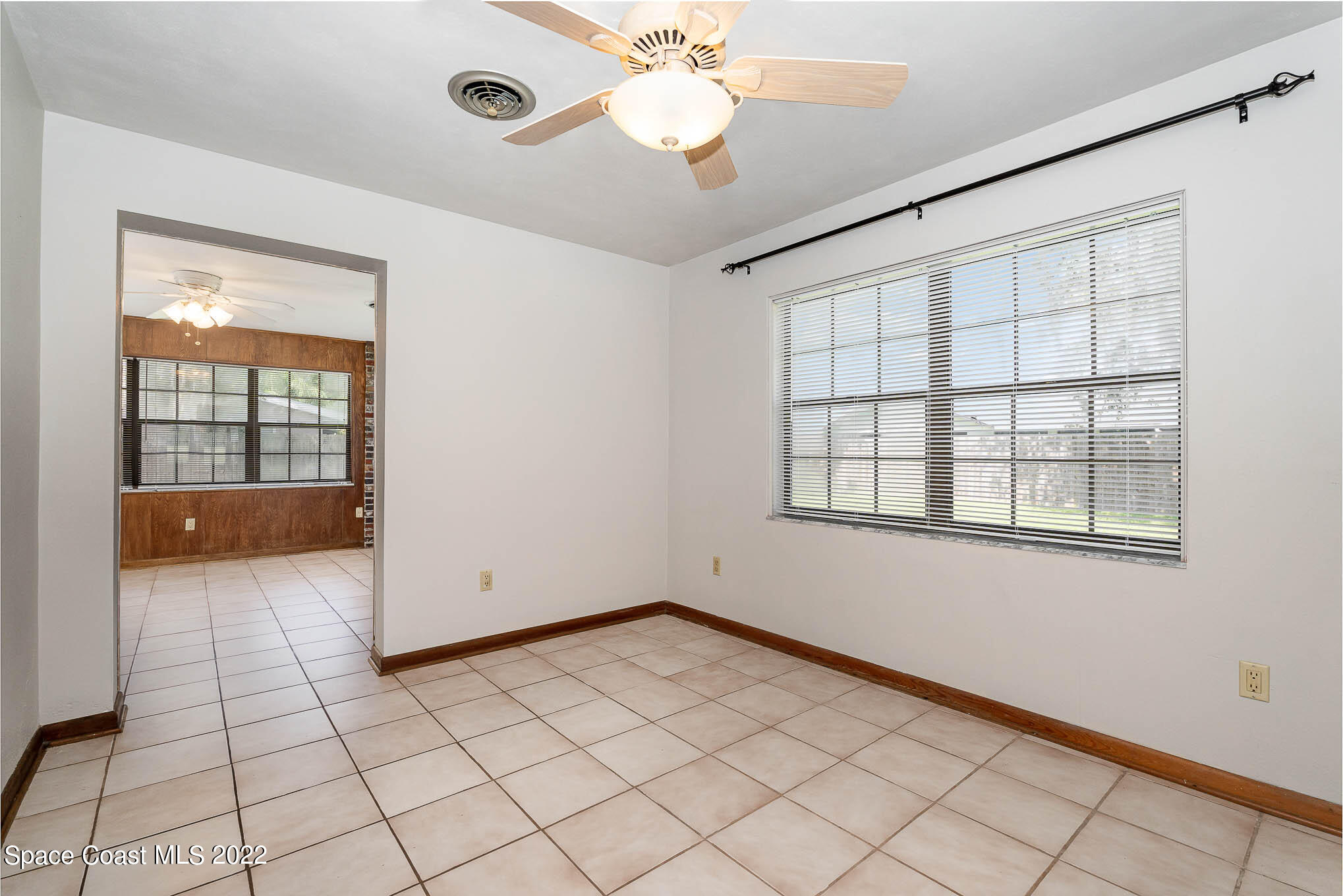 2676 Lemon Street Northeast Palm Bay, FL 32905 - Photo 9 of 35 a view of an empty room with a window