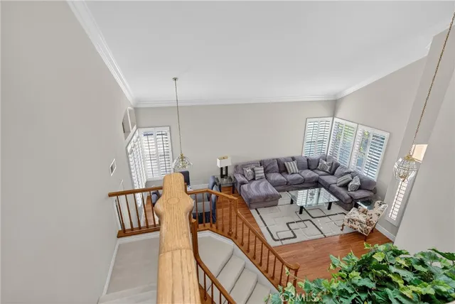 a living room with furniture fireplace and wooden floor