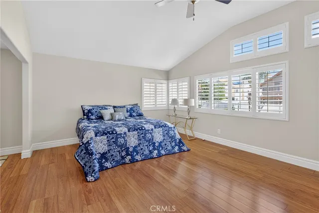 a view of a hallway with wooden floor and glass door