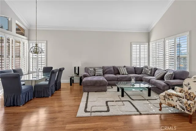 a kitchen with a table chairs sink and cabinets